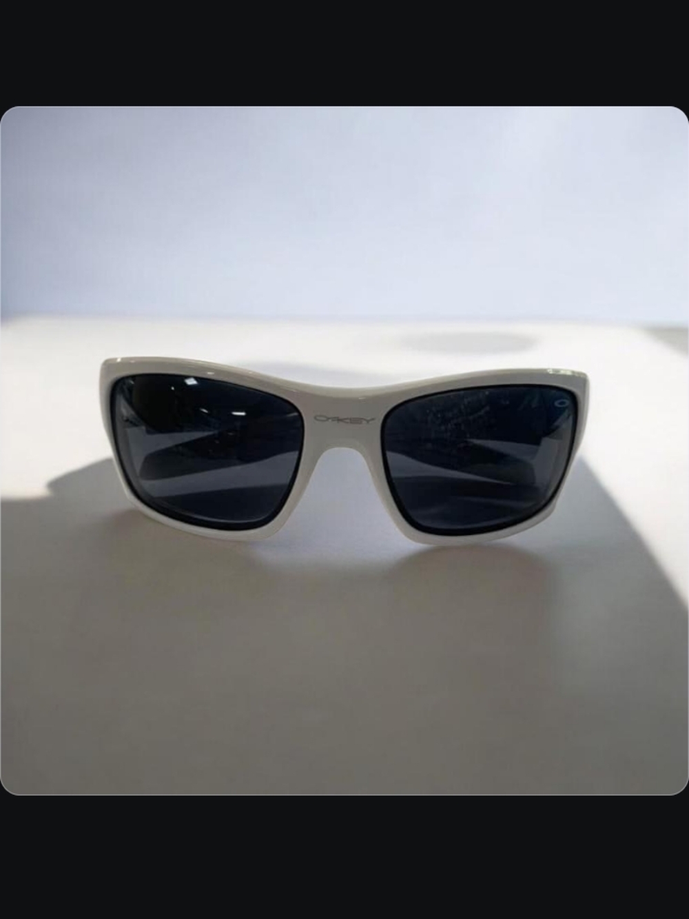 Oakley White Frame Sunglasses with Dark Lenses